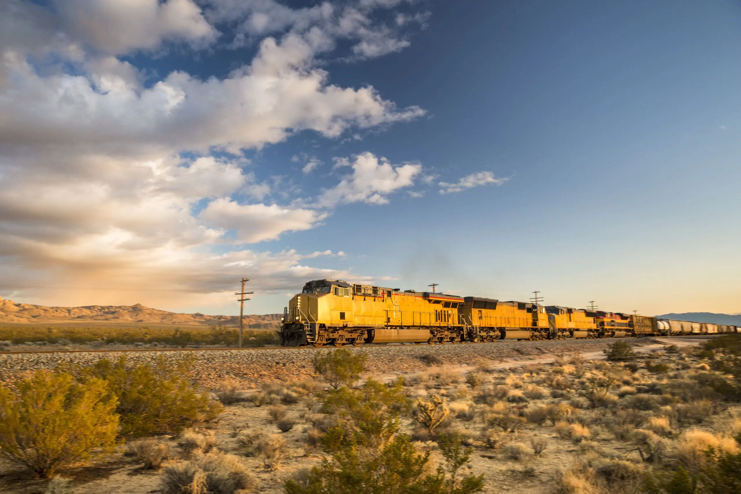Freight train hauling goods travels on the tracks