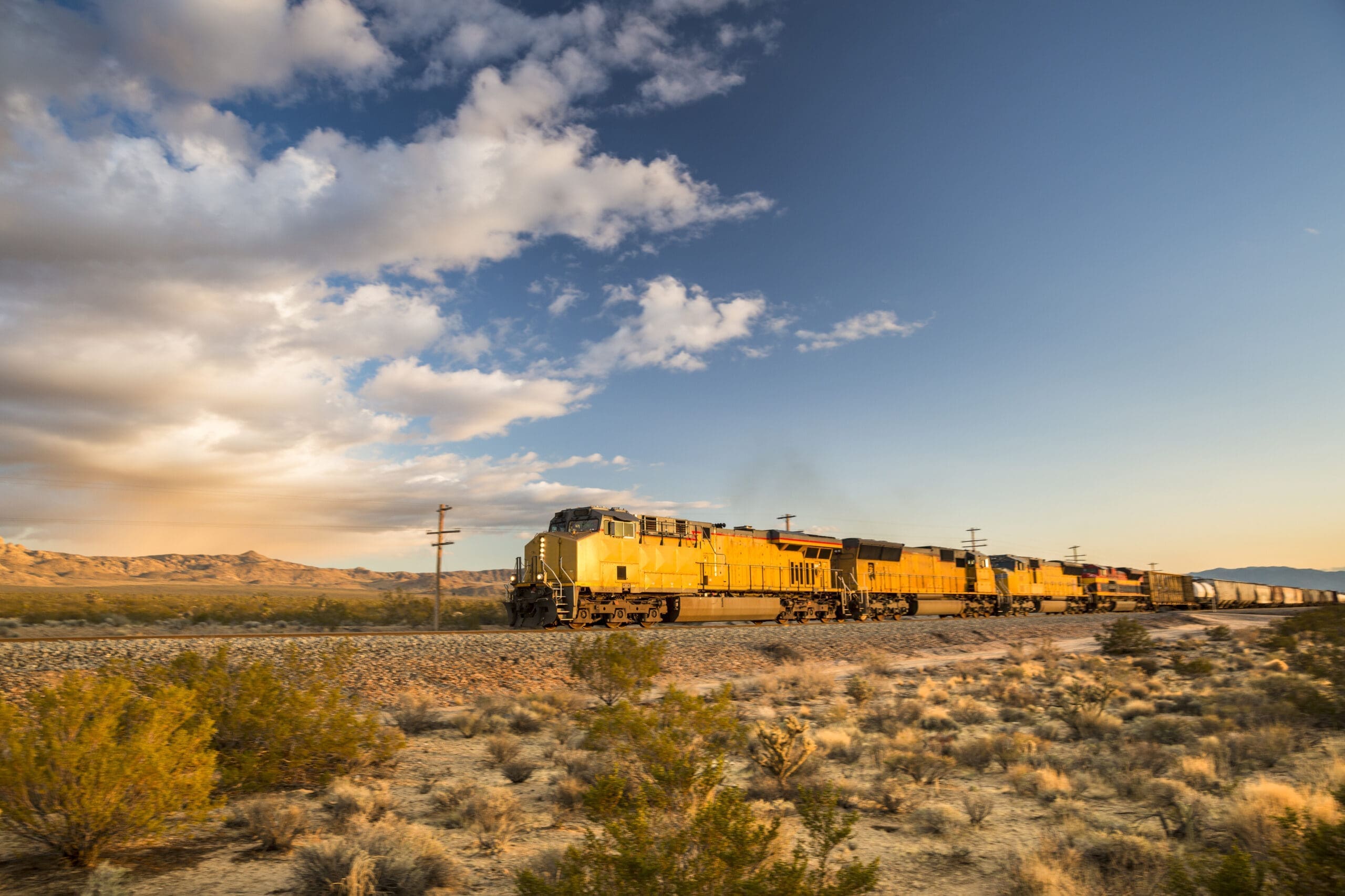 Freight train hauling goods travels on the tracks